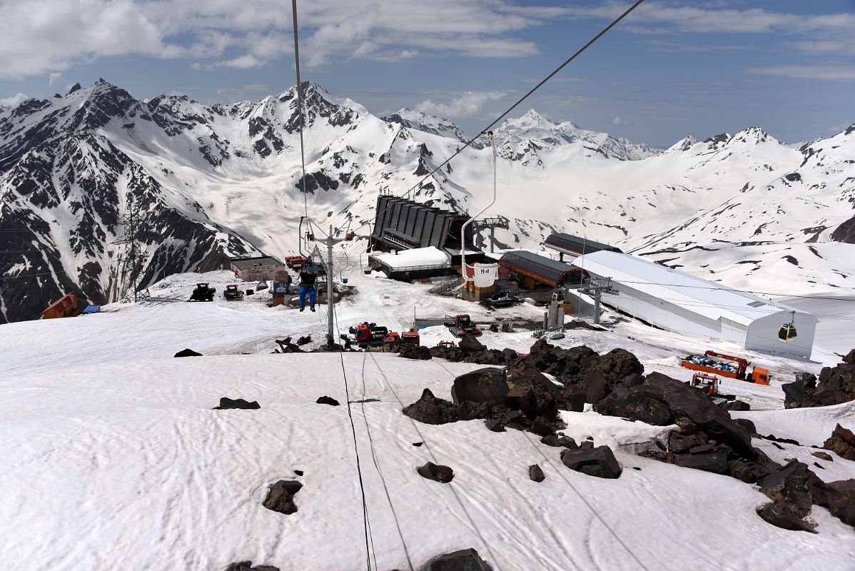 04D Riding The Chair Lift To Garabashi 3730m Looking Back At Mir Cable Car Station 3500m With Mounts Cheget And Shdavleri To Start The Mount Elbrus Climb